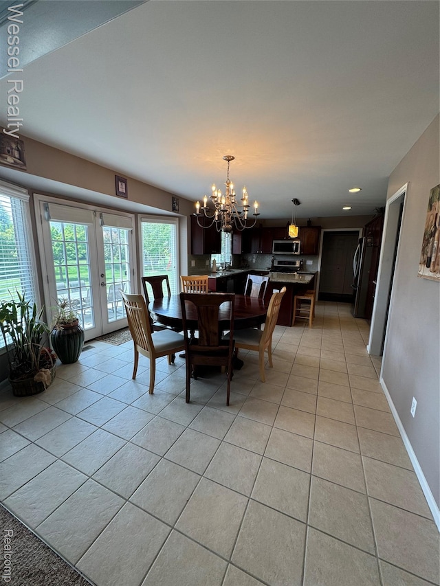 14232 Berryknoll Dr, Shelby Twp, MI 48315 - dining space featuring a chandelier, light tile patterned floors, plenty of natural light, french doors, and recessed lighting