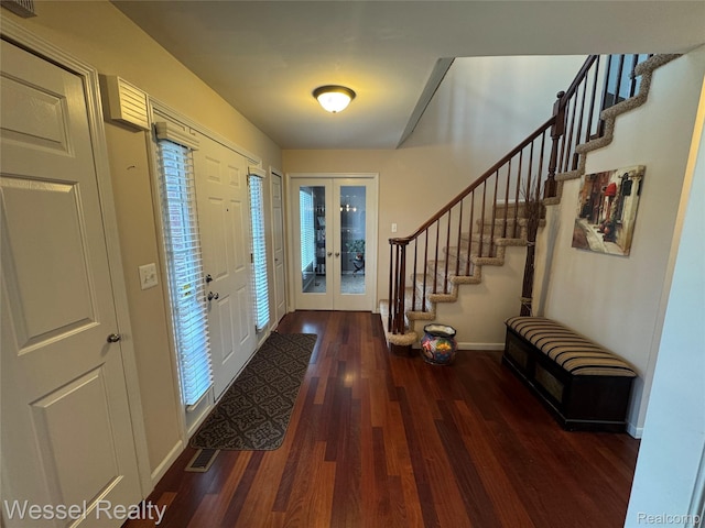14232 Berryknoll Dr, Shelby Twp, MI 48315 - entrance foyer with french doors, wood finished floors, stairway, and baseboards