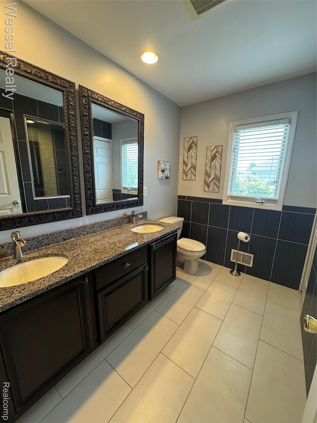 14232 Berryknoll Dr, Shelby Twp, MI 48315 - bathroom with plenty of natural light, tile walls, a shower stall, toilet, and tile patterned flooring