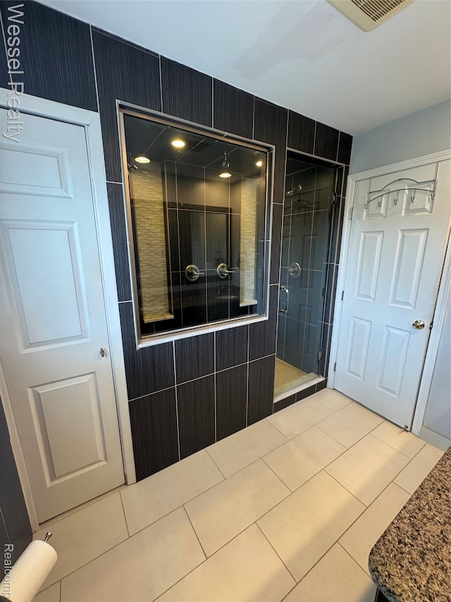 14232 Berryknoll Dr, Shelby Twp, MI 48315 - full bathroom featuring tile patterned floors and a shower stall