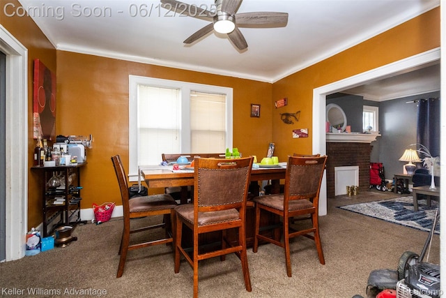 319 Marlborough St, Detroit, MI 48215 - dining space featuring ceiling fan, carpet, a brick fireplace, and crown molding