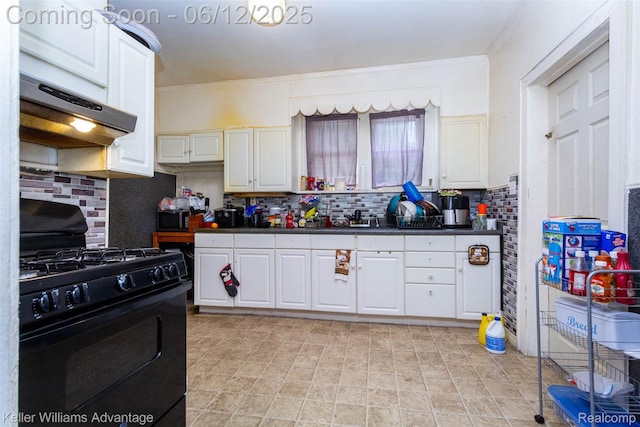 319 Marlborough St, Detroit, MI 48215 - kitchen featuring black gas range oven, under cabinet range hood, dark countertops, tasteful backsplash, and white cabinets