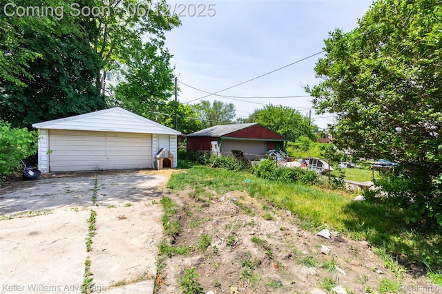 319 Marlborough St, Detroit, MI 48215 - view of yard featuring a garage and an outbuilding
