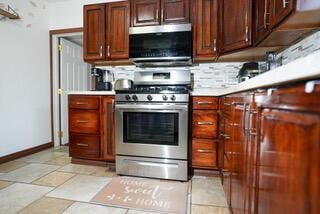 2924 Austin St, Muskegon, MI 49444 - kitchen featuring stainless steel appliances, light countertops, and baseboards