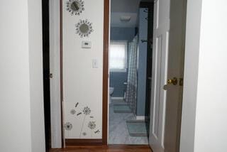 2924 Austin St, Muskegon, MI 49444 - corridor with wood finished floors and baseboards