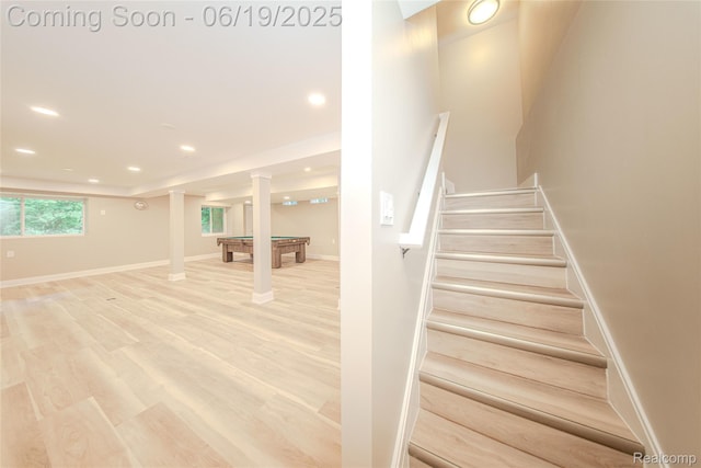 21993 Riverview Dr, Bloomfield Hills, MI 48025 - staircase featuring billiards, wood finished floors, recessed lighting, and ornate columns