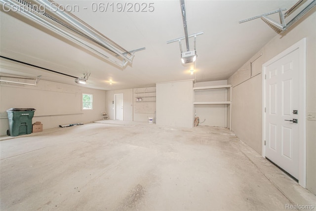 21993 Riverview Dr, Bloomfield Hills, MI 48025 - garage with a garage door opener