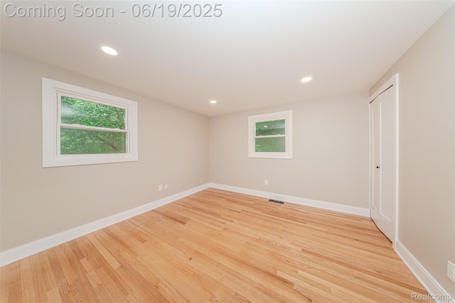 21993 Riverview Dr, Bloomfield Hills, MI 48025 - empty room featuring wood finished floors and recessed lighting