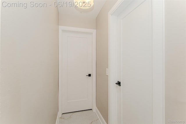 21993 Riverview Dr, Bloomfield Hills, MI 48025 - corridor with baseboards and light marble finish flooring