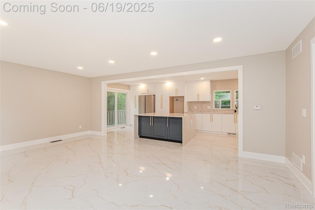 21993 Riverview Dr, Bloomfield Hills, MI 48025 - unfurnished living room featuring light marble finish floors and recessed lighting