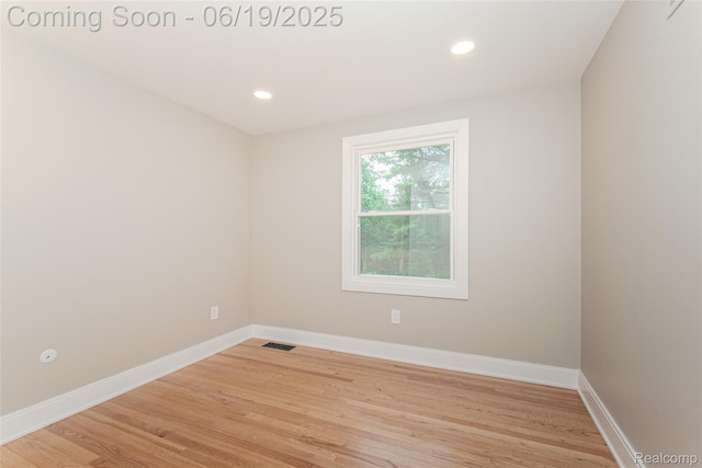 21993 Riverview Dr, Bloomfield Hills, MI 48025 - empty room with light wood-style flooring and recessed lighting