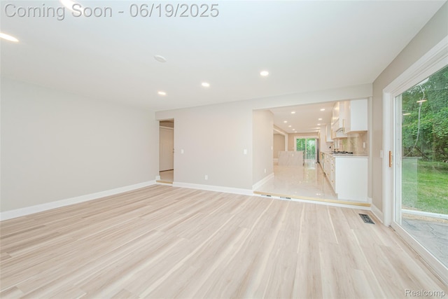 21993 Riverview Dr, Bloomfield Hills, MI 48025 - unfurnished living room with recessed lighting and light wood-style floors