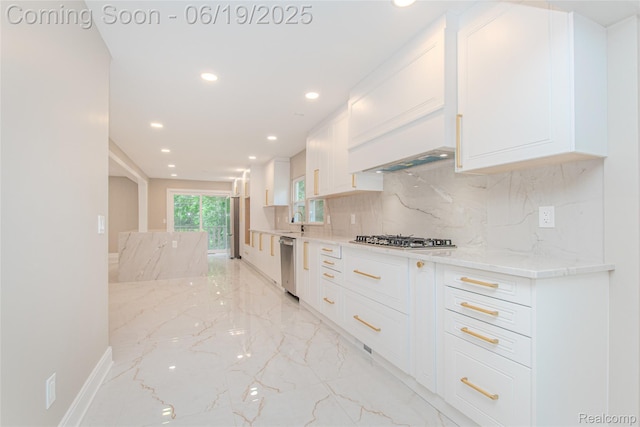 21993 Riverview Dr, Bloomfield Hills, MI 48025 - kitchen featuring light marble finish flooring, appliances with stainless steel finishes, white cabinetry, decorative backsplash, and recessed lighting