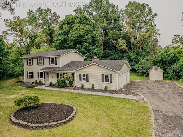 21993 Riverview Dr, Bloomfield Hills, MI 48025 - view of front of property with asphalt driveway, a shed, a garage, a front yard, and a shingled roof