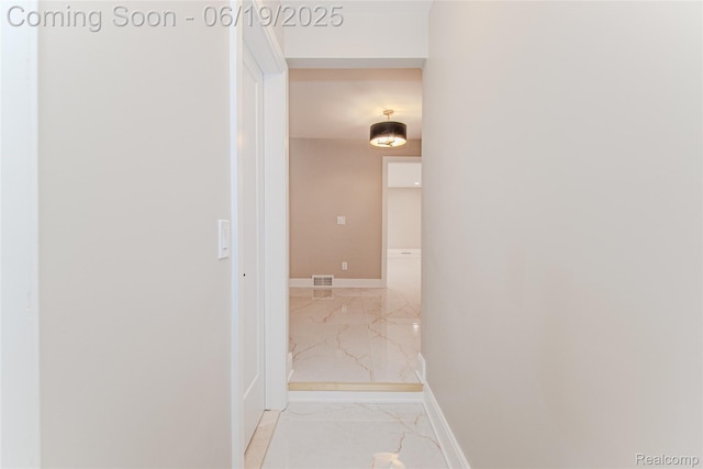 21993 Riverview Dr, Bloomfield Hills, MI 48025 - corridor with marble finish flooring and baseboards