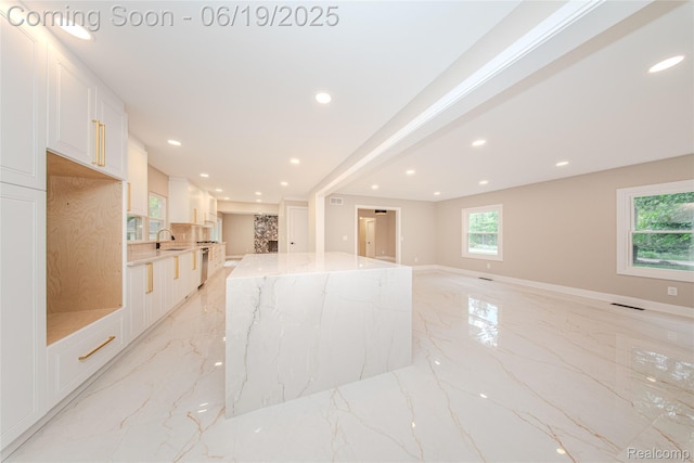 21993 Riverview Dr, Bloomfield Hills, MI 48025 - unfurnished living room featuring light marble finish flooring and recessed lighting