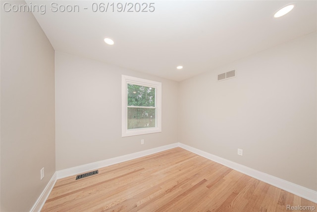 21993 Riverview Dr, Bloomfield Hills, MI 48025 - spare room featuring wood finished floors and recessed lighting