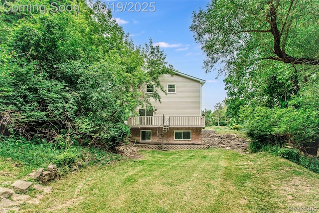 21993 Riverview Dr, Bloomfield Hills, MI 48025 - back of property featuring a yard and a wooden deck