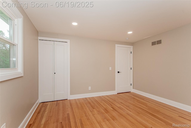 21993 Riverview Dr, Bloomfield Hills, MI 48025 - unfurnished bedroom with light wood finished floors, recessed lighting, and a closet