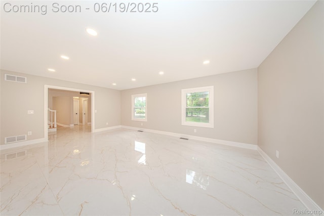 21993 Riverview Dr, Bloomfield Hills, MI 48025 - empty room featuring light marble finish floors and recessed lighting