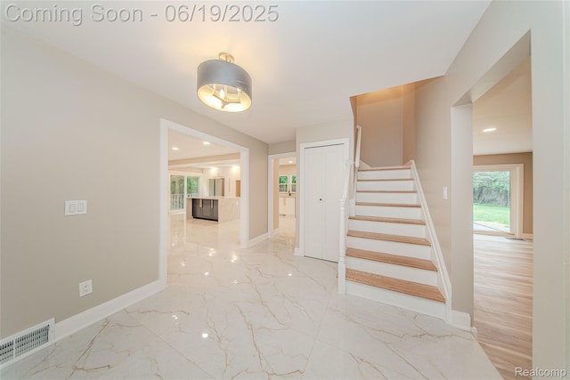 21993 Riverview Dr, Bloomfield Hills, MI 48025 - stairway featuring marble finish floors and recessed lighting