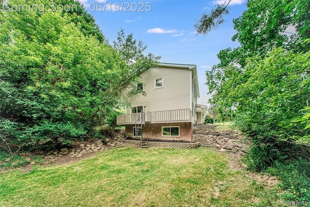 21993 Riverview Dr, Bloomfield Hills, MI 48025 - back of property featuring a lawn and a wooden deck