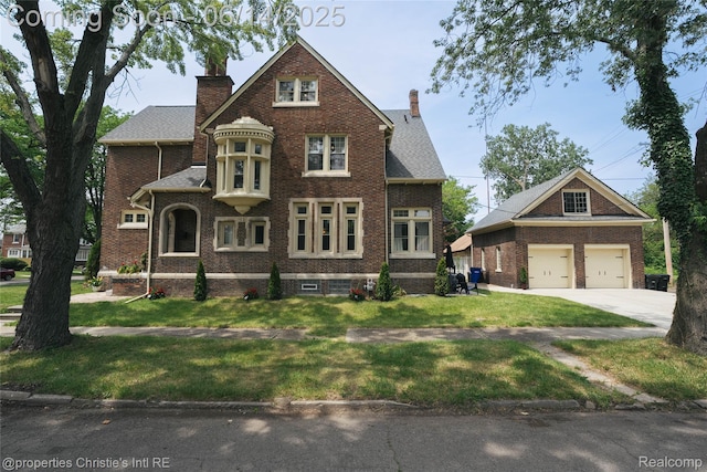 8604 La Salle Blvd, Detroit, MI 48206 - view of front of house featuring a chimney, brick siding, and a front lawn