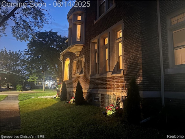 8604 La Salle Blvd, Detroit, MI 48206 - view of home's exterior featuring brick siding and a yard