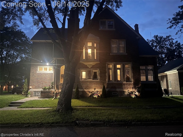 8604 La Salle Blvd, Detroit, MI 48206 - view of front facade featuring a chimney, a front lawn, and brick siding