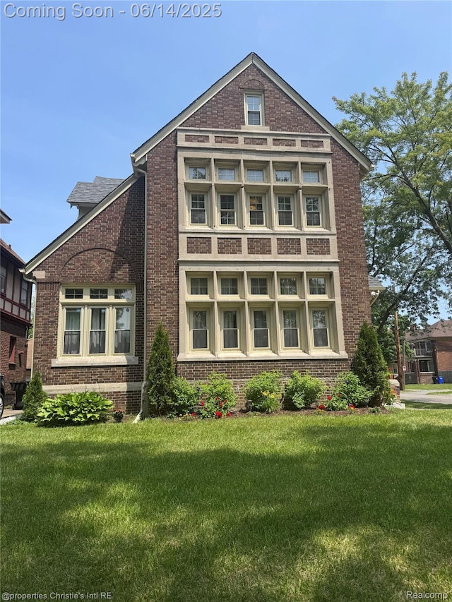 8604 La Salle Blvd, Detroit, MI 48206 - view of front facade with brick siding and a front yard
