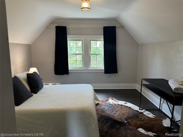 8604 La Salle Blvd, Detroit, MI 48206 - bedroom with lofted ceiling and wood finished floors