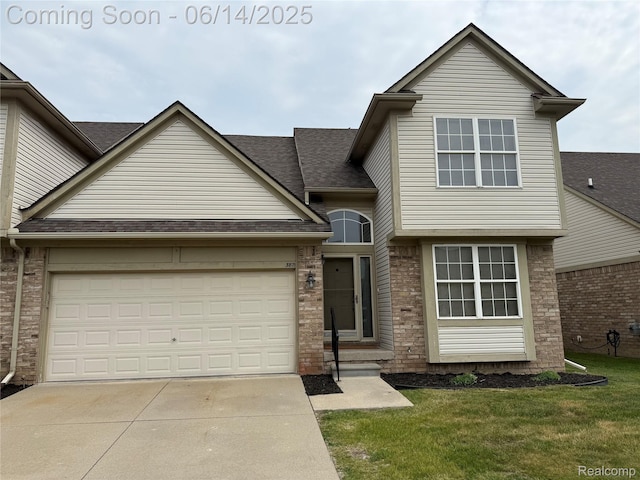 3871 Elvera Ln, Warren, MI 48092 - traditional-style house with concrete driveway, a front lawn, an attached garage, and brick siding