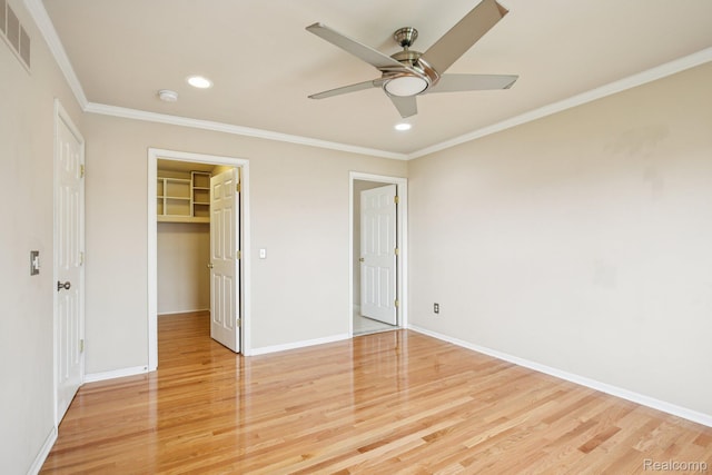 3871 Elvera Ln, Warren, MI 48092 - unfurnished bedroom featuring light wood finished floors, recessed lighting, a spacious closet, ornamental molding, and a closet