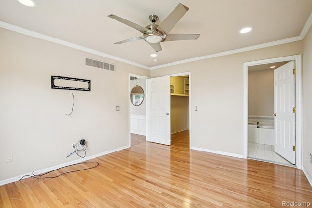 3871 Elvera Ln, Warren, MI 48092 - unfurnished bedroom featuring light wood-style floors, recessed lighting, ornamental molding, a walk in closet, and connected bathroom