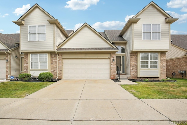 3871 Elvera Ln, Warren, MI 48092 - view of front of home with brick siding, a garage, a front yard, and concrete driveway