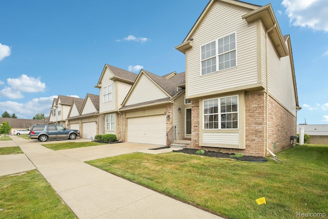 3871 Elvera Ln, Warren, MI 48092 - townhome / multi-family property featuring driveway, brick siding, a front lawn, and an attached garage