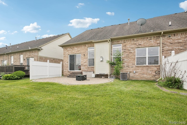 3871 Elvera Ln, Warren, MI 48092 - rear view of house featuring entry steps, a patio, brick siding, and roof with shingles