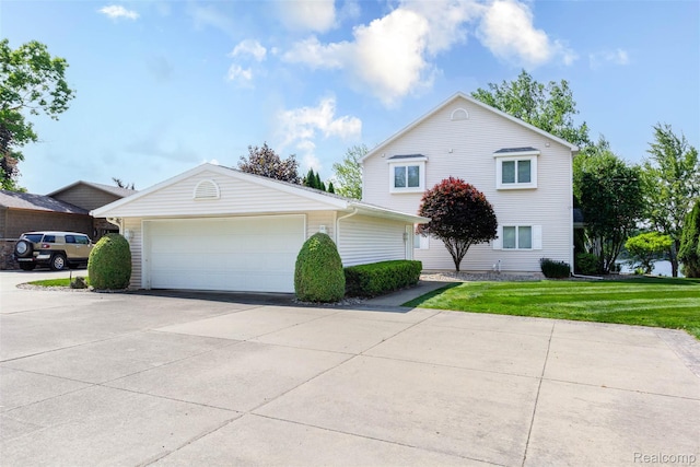 6081 Byram Lake Dr, Linden, MI 48451 - view of front of house featuring a front lawn, an attached garage, and driveway