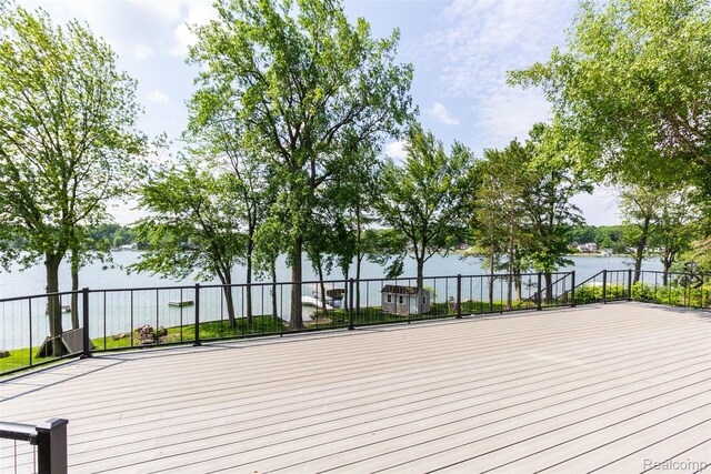 6081 Byram Lake Dr, Linden, MI 48451 - wooden terrace with a water view