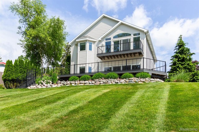 6081 Byram Lake Dr, Linden, MI 48451 - back of property with a balcony and a yard