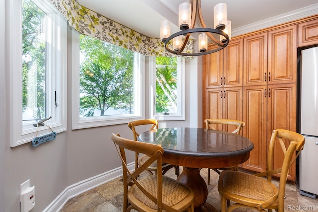 6081 Byram Lake Dr, Linden, MI 48451 - dining space featuring a chandelier and baseboards