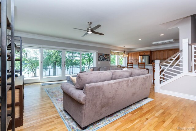 6081 Byram Lake Dr, Linden, MI 48451 - living room featuring ornamental molding, a ceiling fan, light wood-type flooring, stairs, and recessed lighting