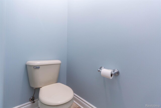 6081 Byram Lake Dr, Linden, MI 48451 - bathroom with baseboards and toilet