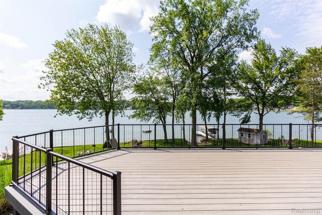 6081 Byram Lake Dr, Linden, MI 48451 - wooden terrace with a water view