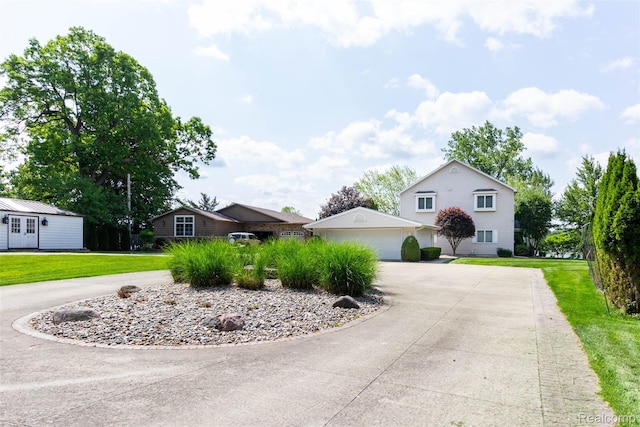 6081 Byram Lake Dr, Linden, MI 48451 - view of front facade with curved driveway, a front lawn, and a garage