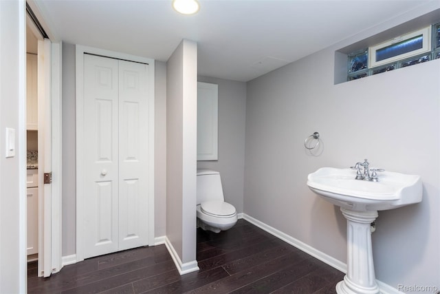 6081 Byram Lake Dr, Linden, MI 48451 - bathroom featuring a closet and wood finished floors