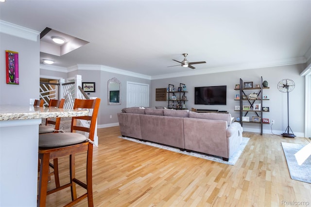 6081 Byram Lake Dr, Linden, MI 48451 - living room featuring light wood-style floors, ceiling fan, and crown molding