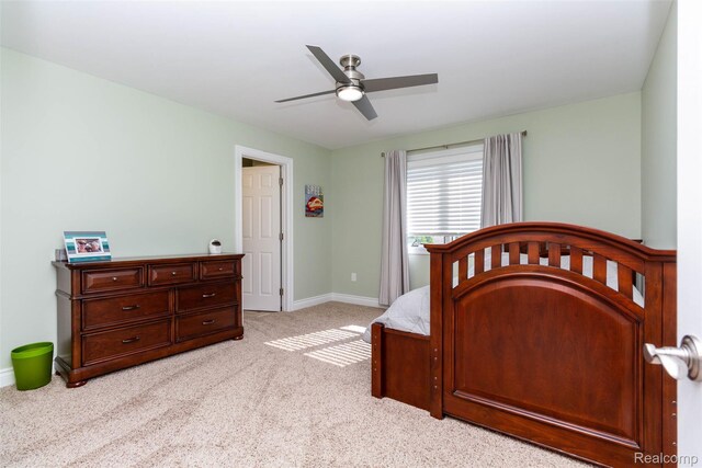 6081 Byram Lake Dr, Linden, MI 48451 - bedroom with light carpet and a ceiling fan