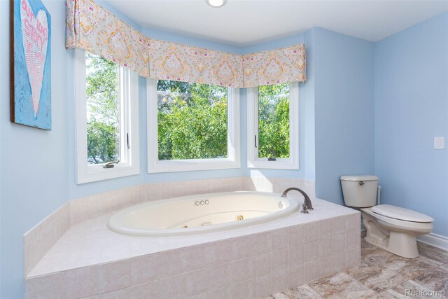 6081 Byram Lake Dr, Linden, MI 48451 - full bathroom featuring a tub with jets and plenty of natural light