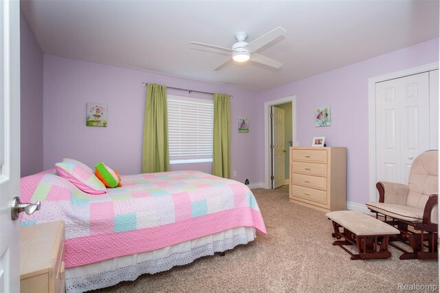 6081 Byram Lake Dr, Linden, MI 48451 - bedroom with light colored carpet, a closet, and a ceiling fan
